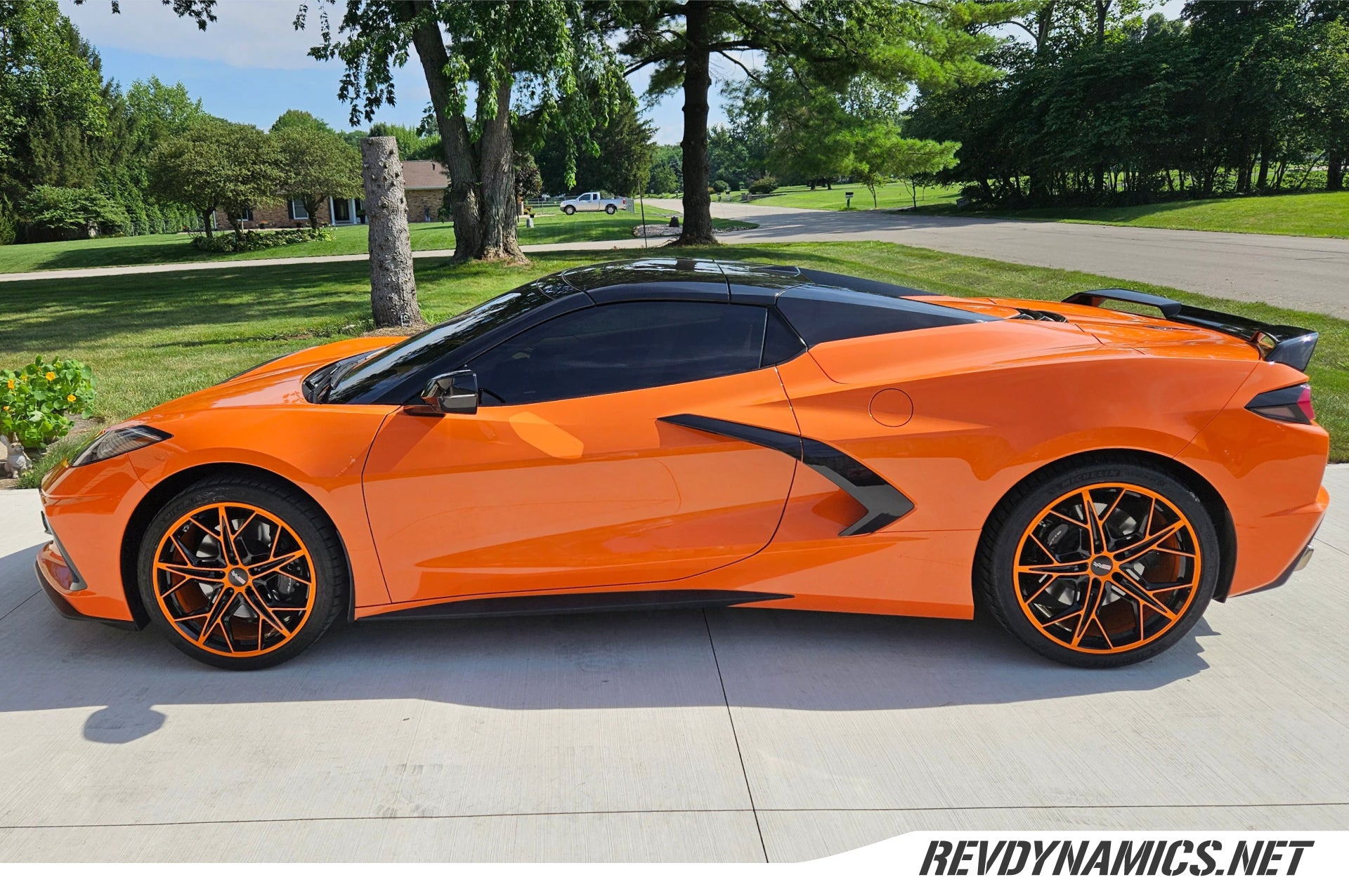 Corvette C8 with 19 and 20 in staggered cray hammerhead amplified orange and black wheels by rev dynamics