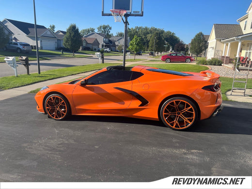 Corvette C8 with Amplify Orange and Gloss Black wheels powder coated by Rev Dynamics