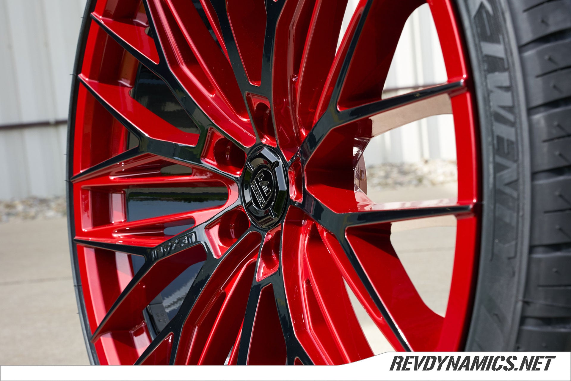 Custom Lexani Aries wheels forr a Corvette C8 color matched in Red Mist and Black two tone